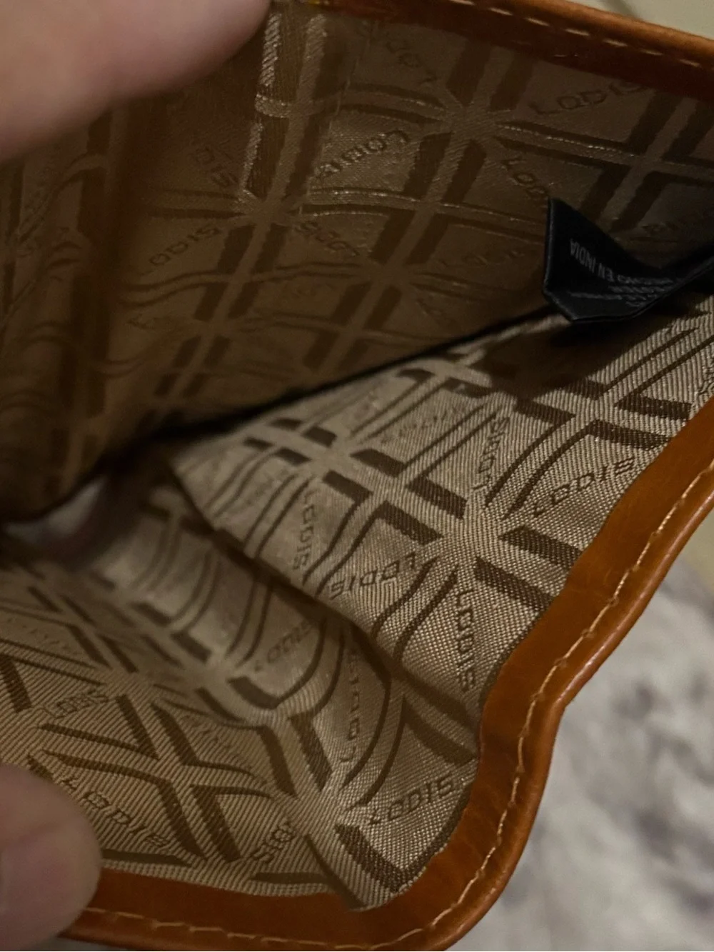 Lodis wallet brown leather featuring knotted tap detail